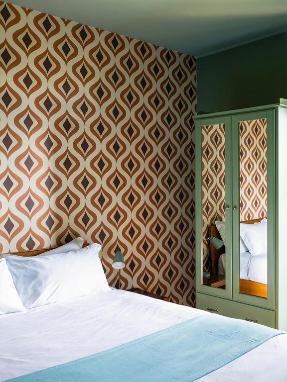 A bed or beds in a room at Domus Plinii 1792 Suites