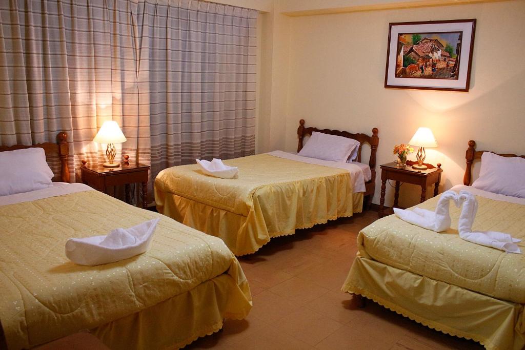 Postel nebo postele na pokoji v ubytování MAGICPERU BaCKPACKERS