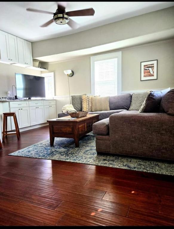 a living room with a couch and a coffee table at Charming, cozy, one bedroom apartment in Lakeland
