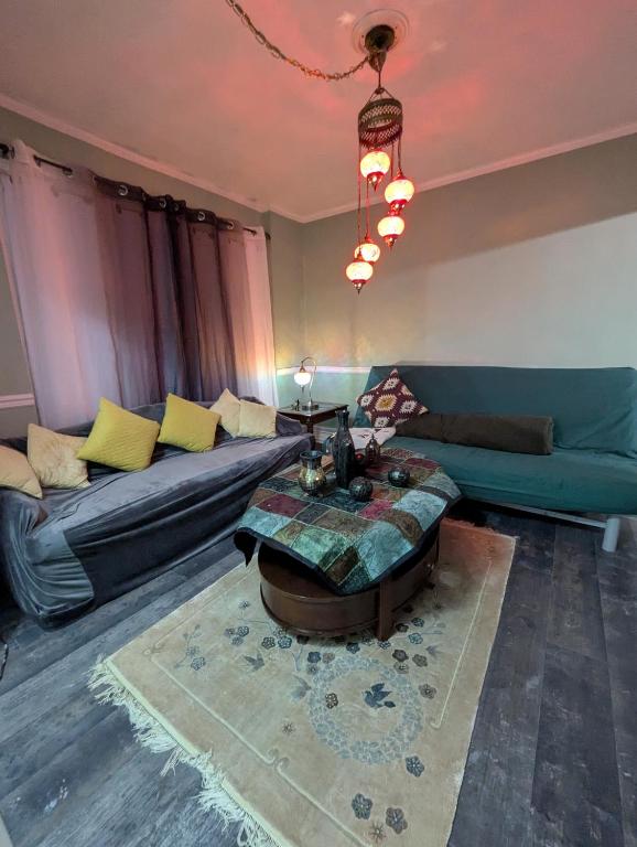 a living room with a couch and a table at NewResidence in Niagara Falls