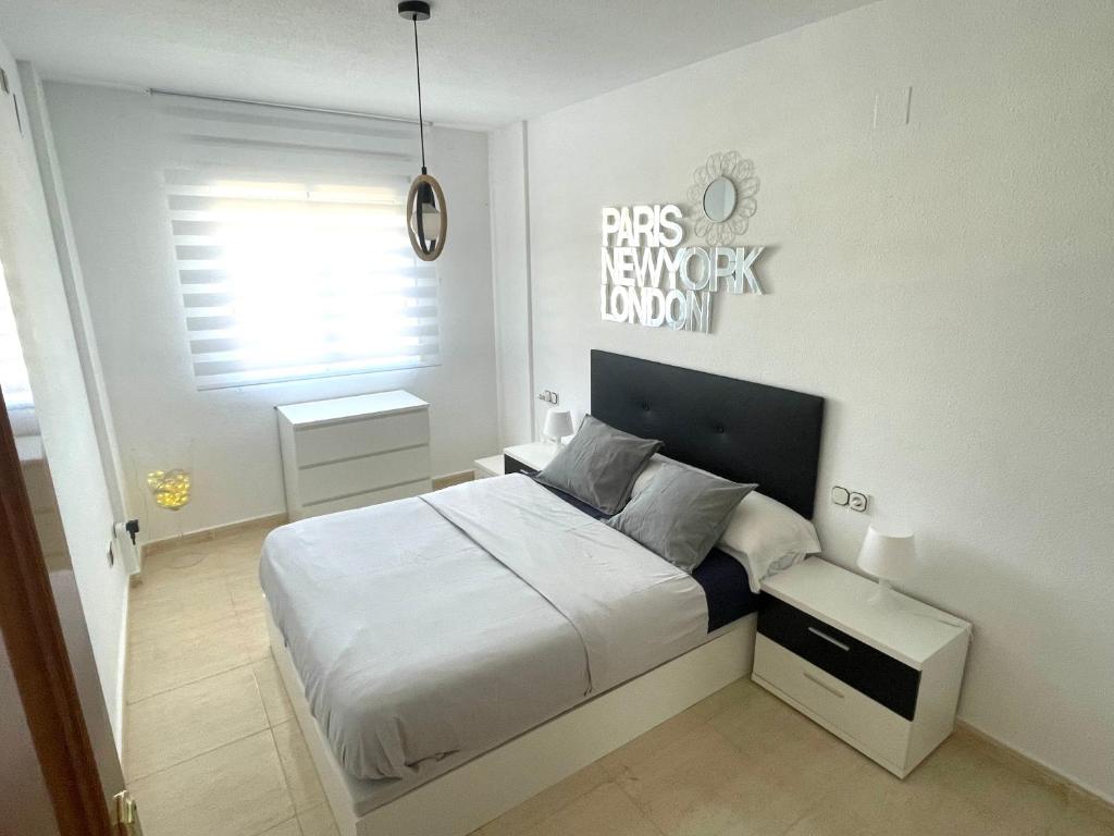 A bed or beds in a room at Pretty bungalow with Prívate terrace