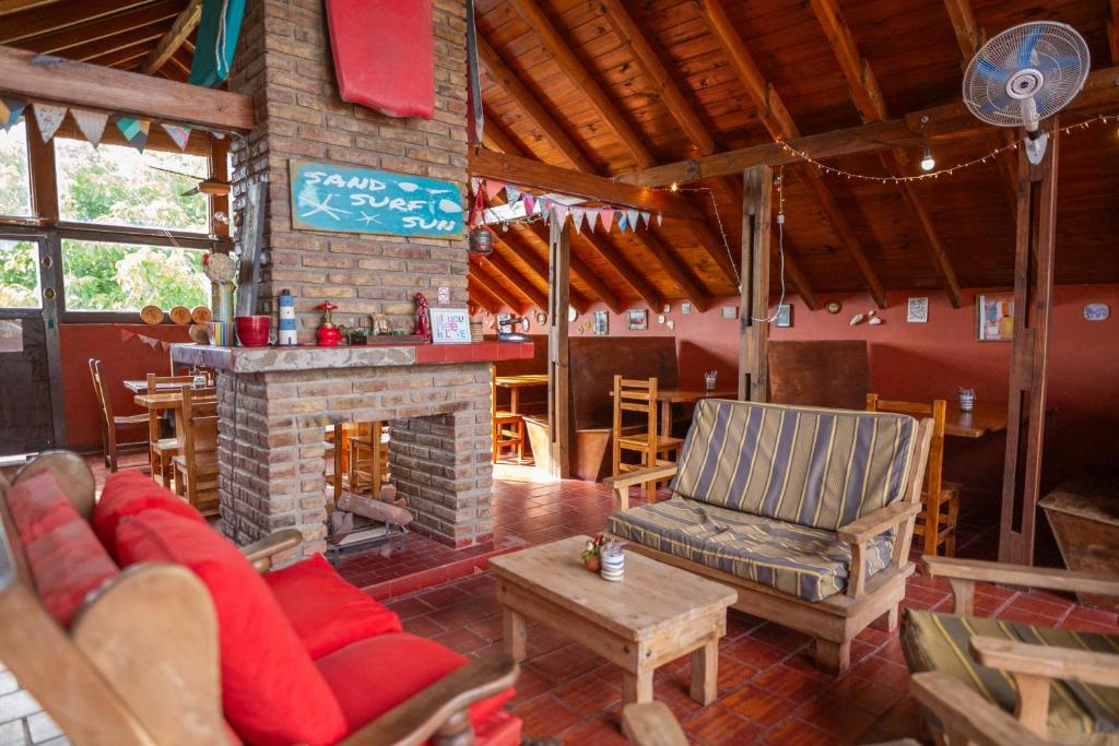 a living room with a couch and a fireplace at Las Grullas in Villa Gesell