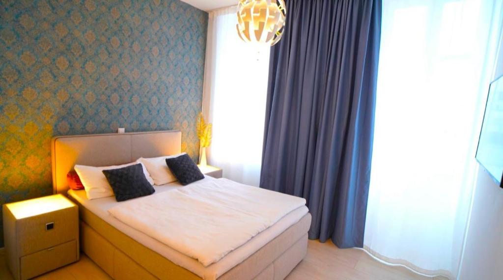 Postel nebo postele na pokoji v ubytování Hotel Astra