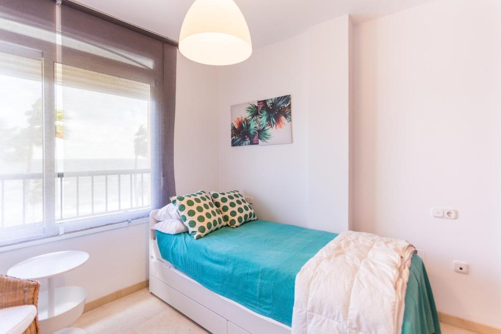 Postel nebo postele na pokoji v ubytování Bonito Apartamento en Primera Línea de Playa