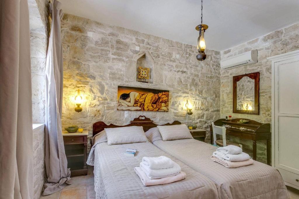 Posteľ alebo postele v izbe v ubytovaní Villa Vincenzos by Villa Plus