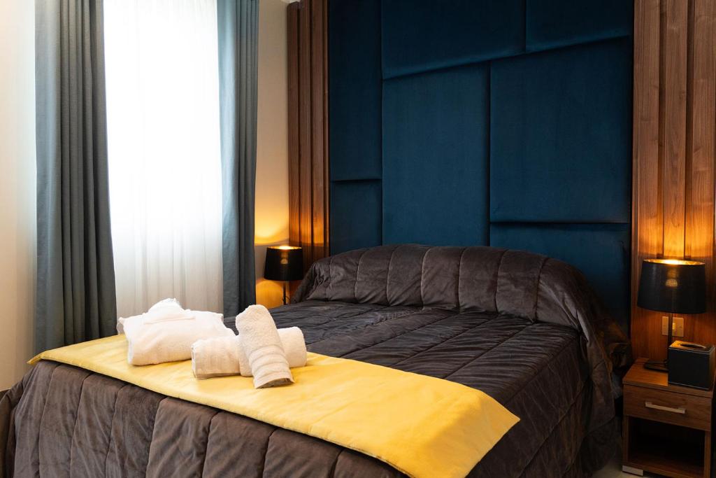 Postel nebo postele na pokoji v ubytování Domus Boutique Hotel
