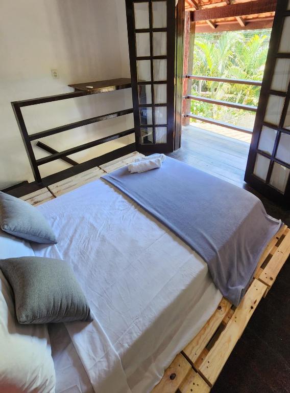Cama ou camas em um quarto em Pousada Pitaya Maresias
