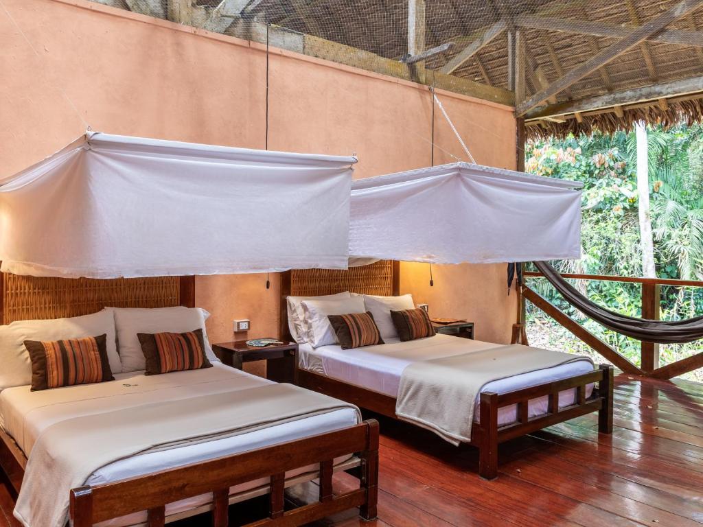 Postel nebo postele na pokoji v ubytování Refugio Amazonas Lodge