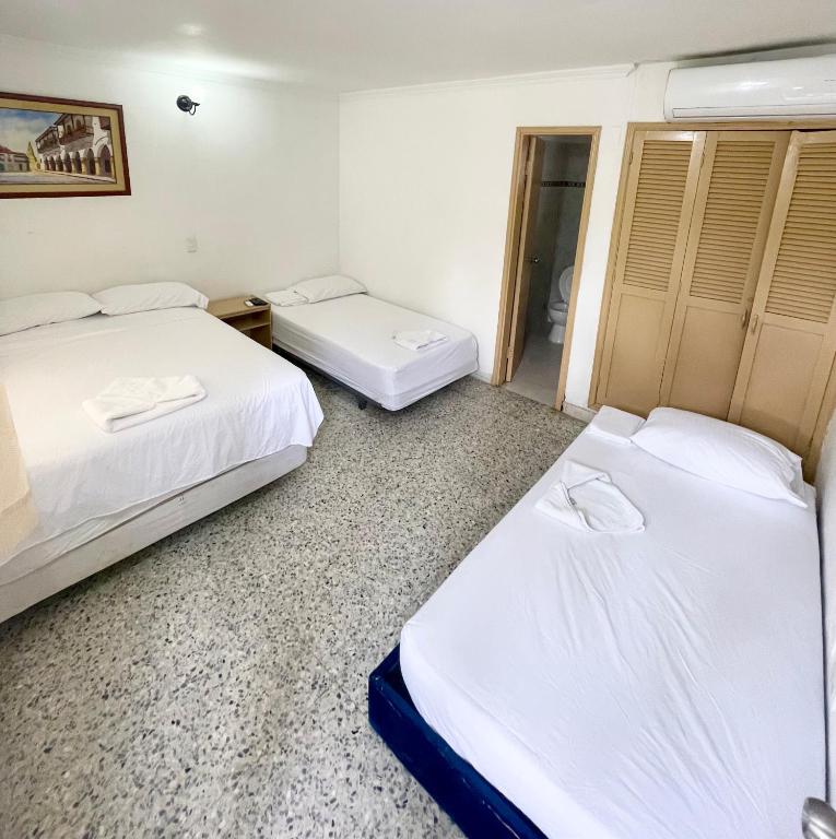 Postel nebo postele na pokoji v ubytování Hotel Casa Fátima