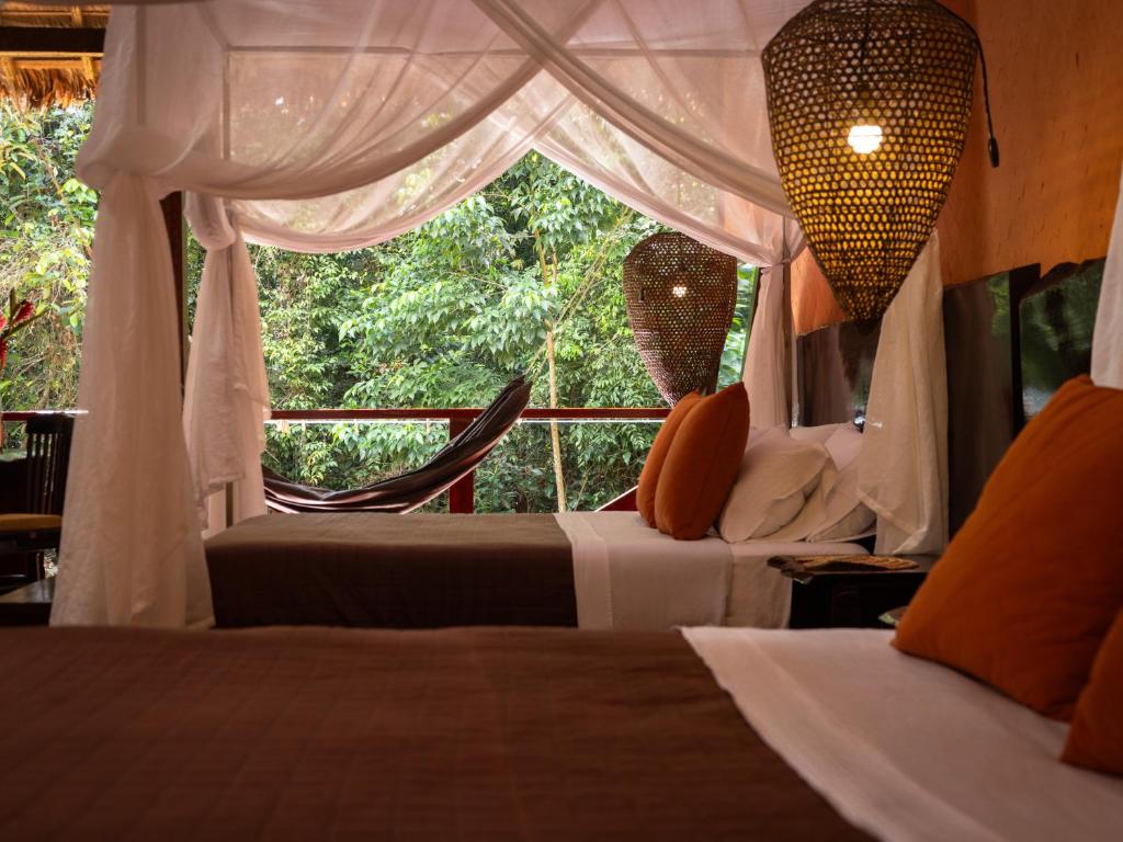 Postel nebo postele na pokoji v ubytování Refugio Amazonas Lodge