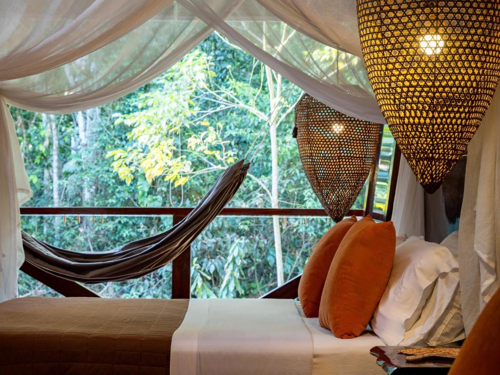 Postel nebo postele na pokoji v ubytování Refugio Amazonas Lodge
