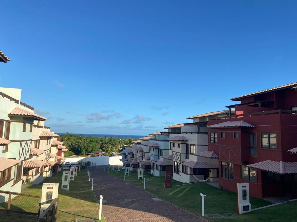 arial view of a row of apartment buildings at Recanto Brisas de Imbassaí Village C18 in Mata de Sao Joao