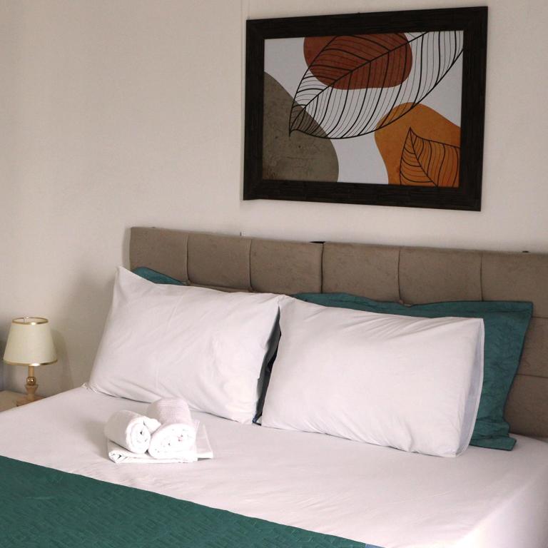Postel nebo postele na pokoji v ubytování Simar Hotel