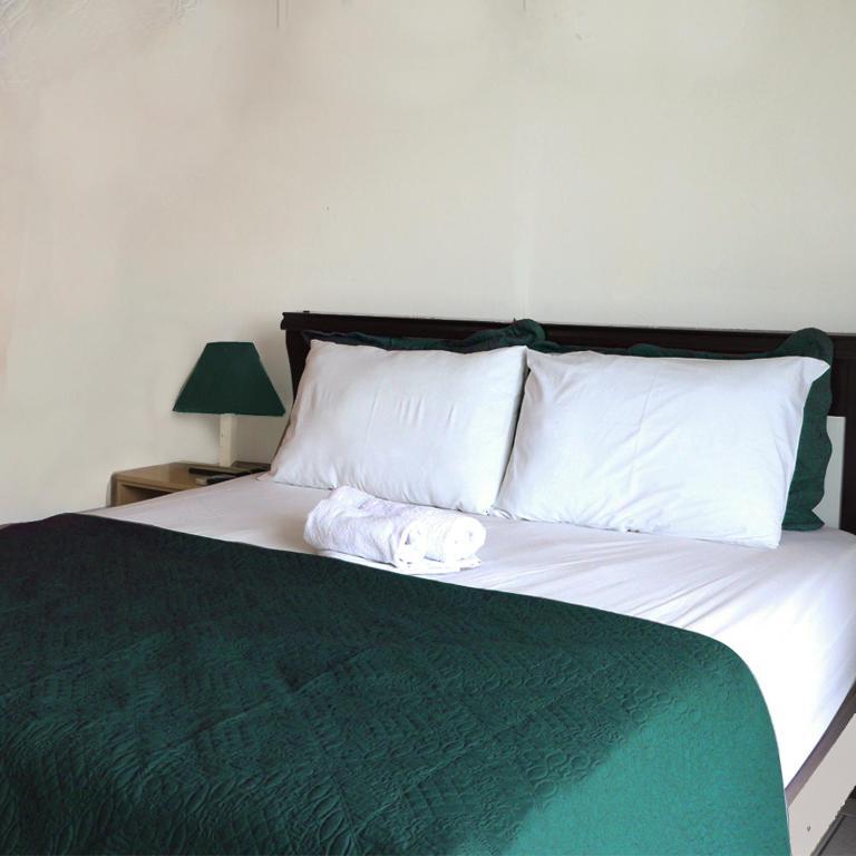 Postel nebo postele na pokoji v ubytování Simar Hotel