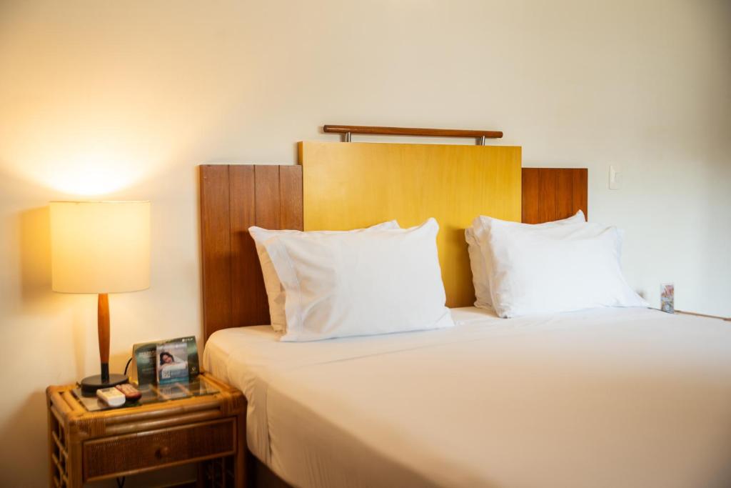 Postel nebo postele na pokoji v ubytování Estelar Santamar Hotel & Centro De Convenciones