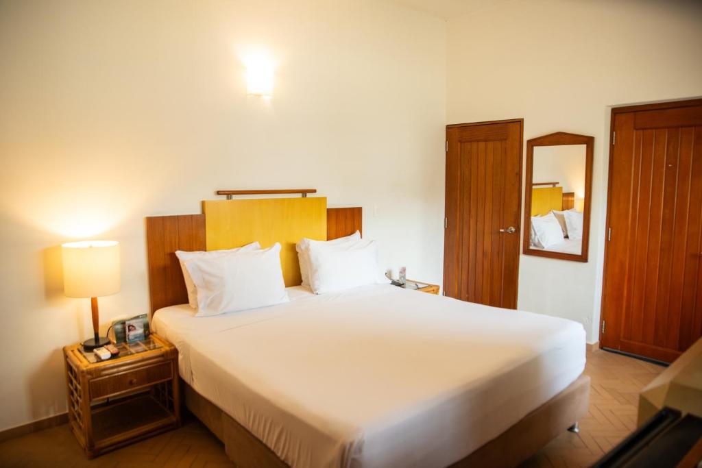 Postel nebo postele na pokoji v ubytování Estelar Santamar Hotel & Centro De Convenciones