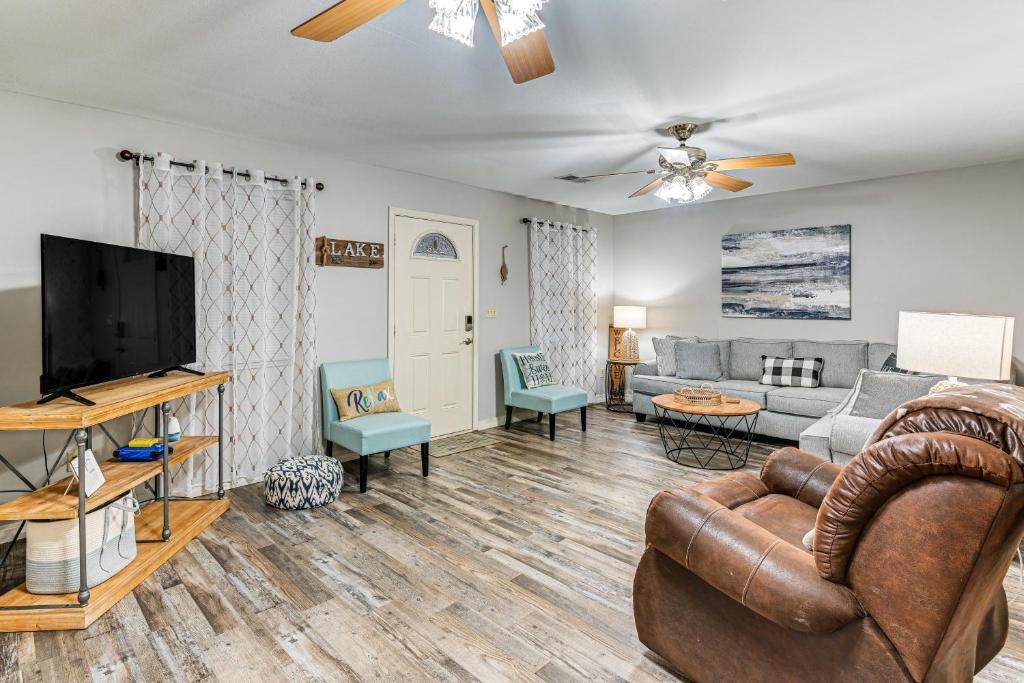 a living room with a couch and a tv at Kentucky Lake Retreat Near Marina and Launch! in Faxon