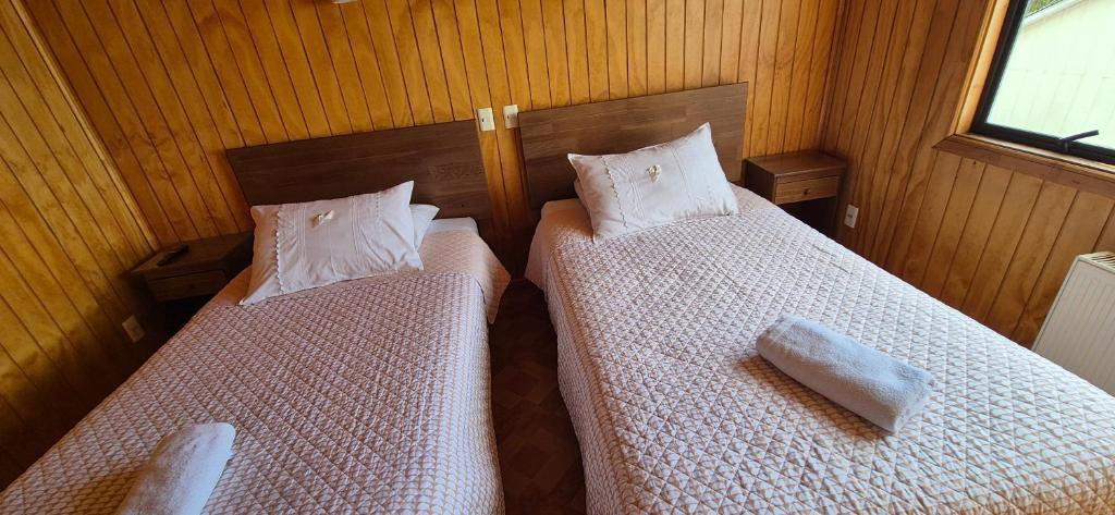 Postel nebo postele na pokoji v ubytování Hostal Nancy