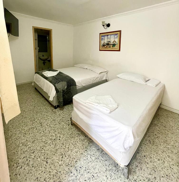 Postel nebo postele na pokoji v ubytování Hotel Casa Fátima