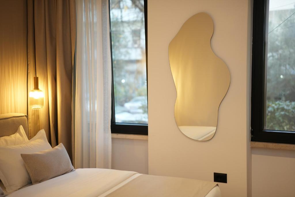 Postel nebo postele na pokoji v ubytování NEA Deluxe Apart-Hotel