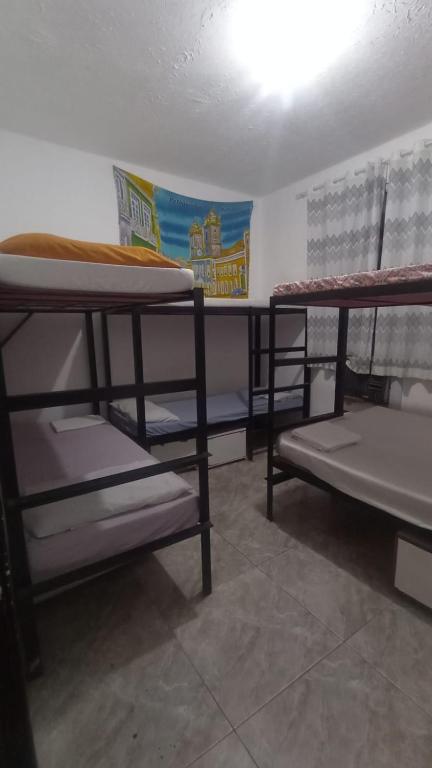Postel nebo postele na pokoji v ubytování hostel quintal da sereia