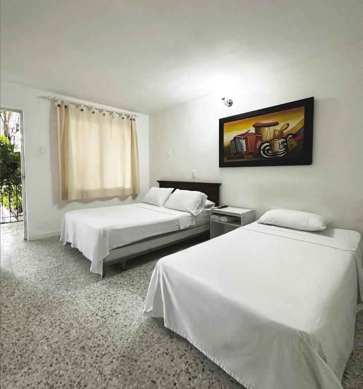 Postel nebo postele na pokoji v ubytování Hotel Casa Fátima