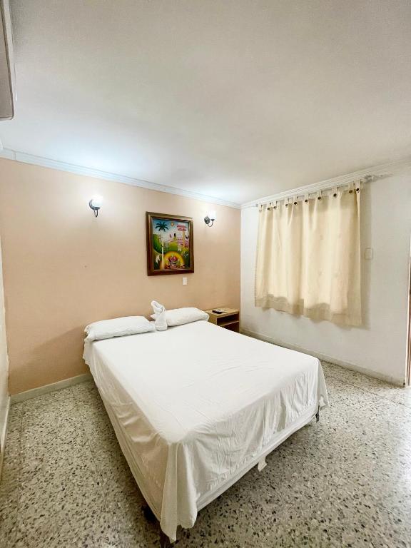 Postel nebo postele na pokoji v ubytování Hotel Casa Fátima