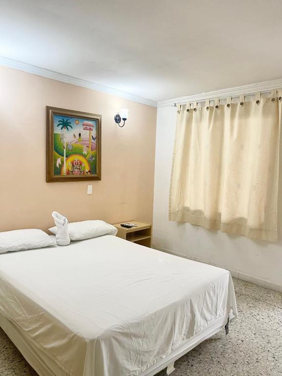 Postel nebo postele na pokoji v ubytování Hotel Casa Fátima