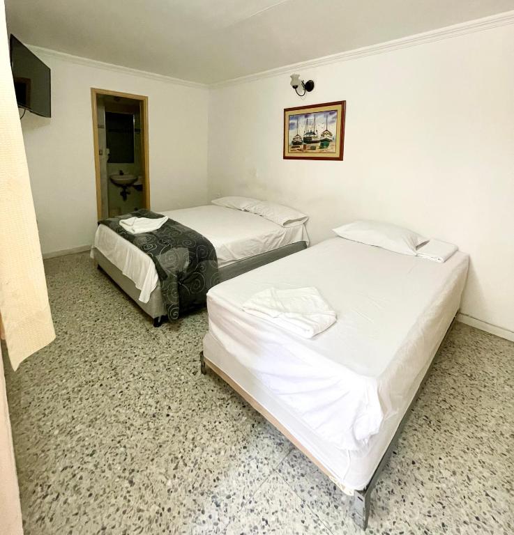 Postel nebo postele na pokoji v ubytování Hotel Casa Fátima