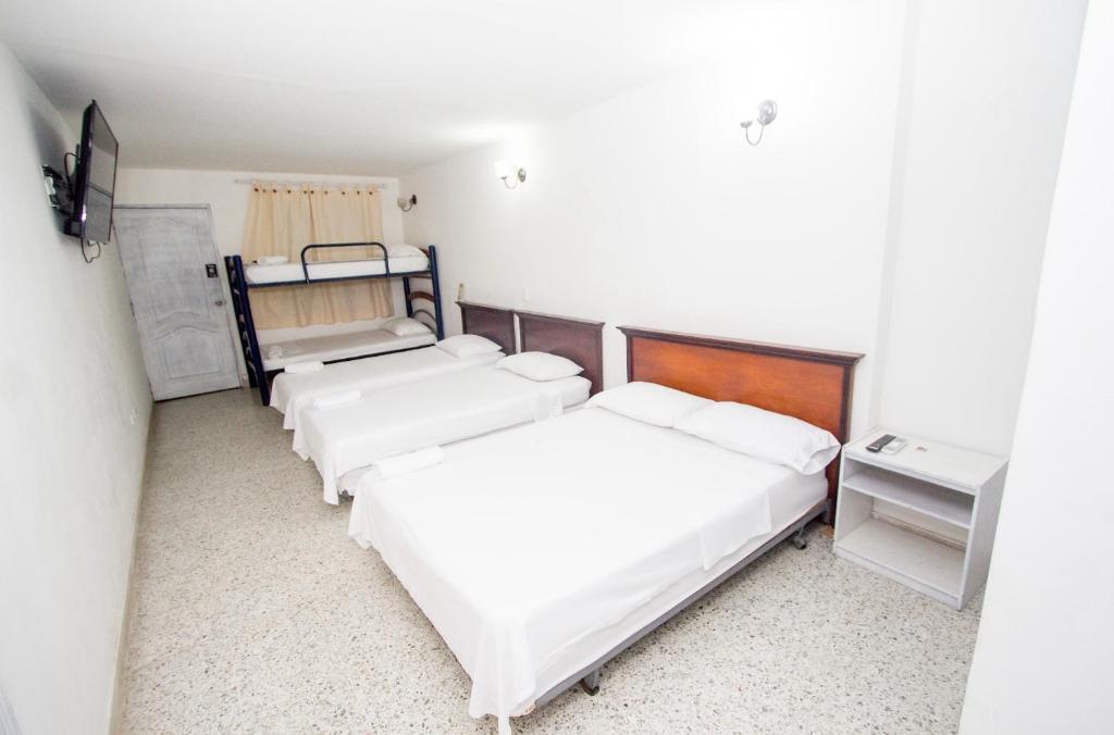 Postel nebo postele na pokoji v ubytování Hotel Casa Fátima
