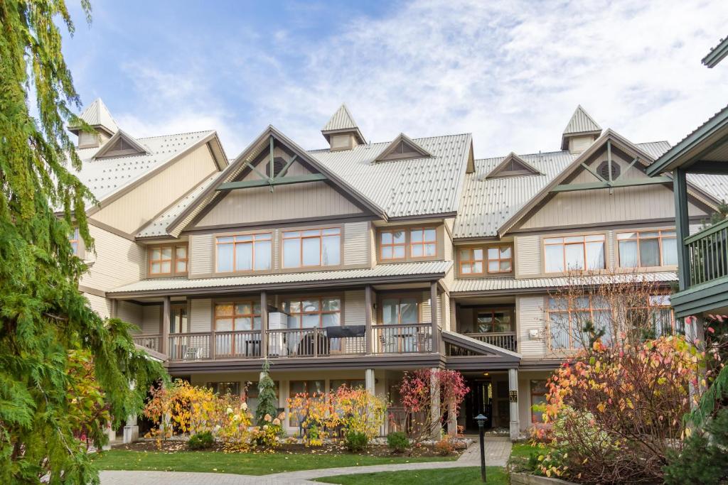 an exterior view of a large house at Bright and Clean, Walk Everywhere, Shared Pool and Hot Tub in Whistler