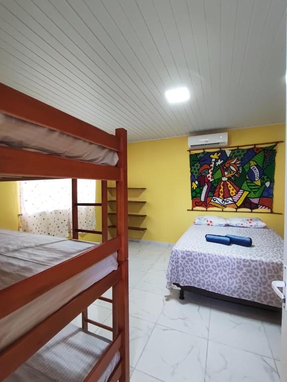 Postel nebo postele na pokoji v ubytování Paraíso Beach Hostel e Pousada