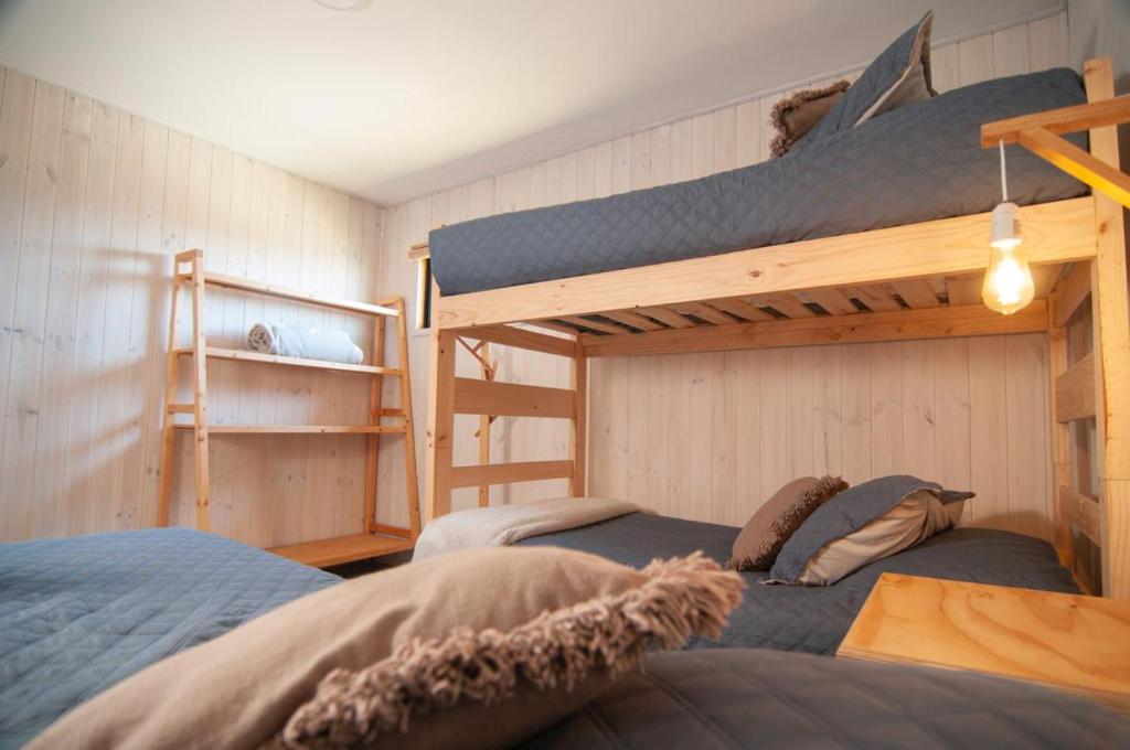Voodi või voodid majutusasutuse 7 Olas lodge toas