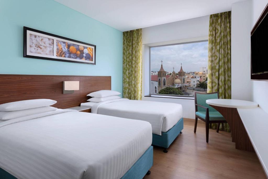 Postel nebo postele na pokoji v ubytování Fairfield by Marriott Coimbatore