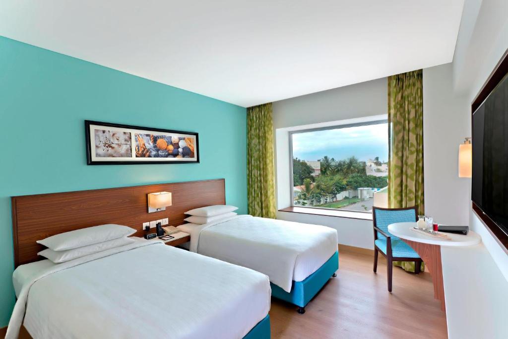 Postel nebo postele na pokoji v ubytování Fairfield by Marriott Coimbatore