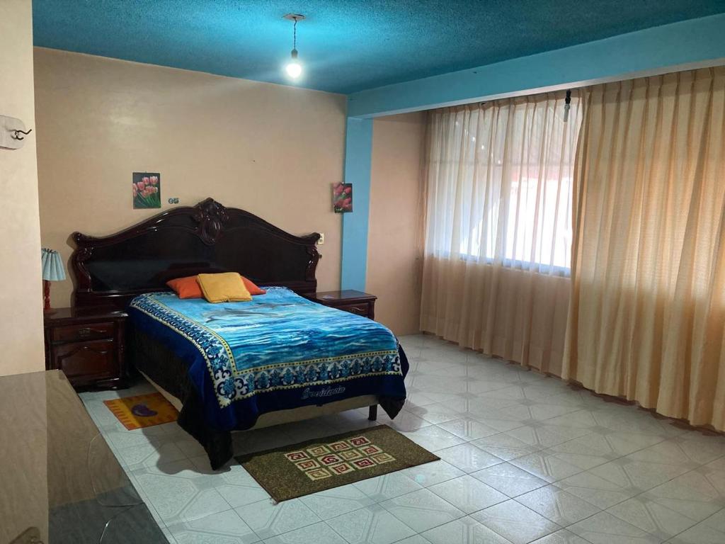 Ένα ή περισσότερα κρεβάτια σε δωμάτιο στο Casa Particular