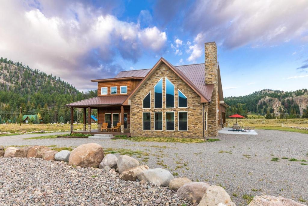 a house with rocks in front of it at MountainAire in South Fork, CO in South Fork