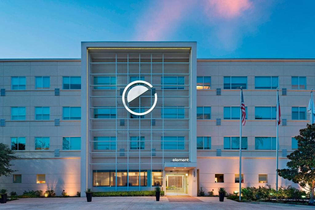 an office building with a large logo on it at Element Houston Vintage Park in Houston