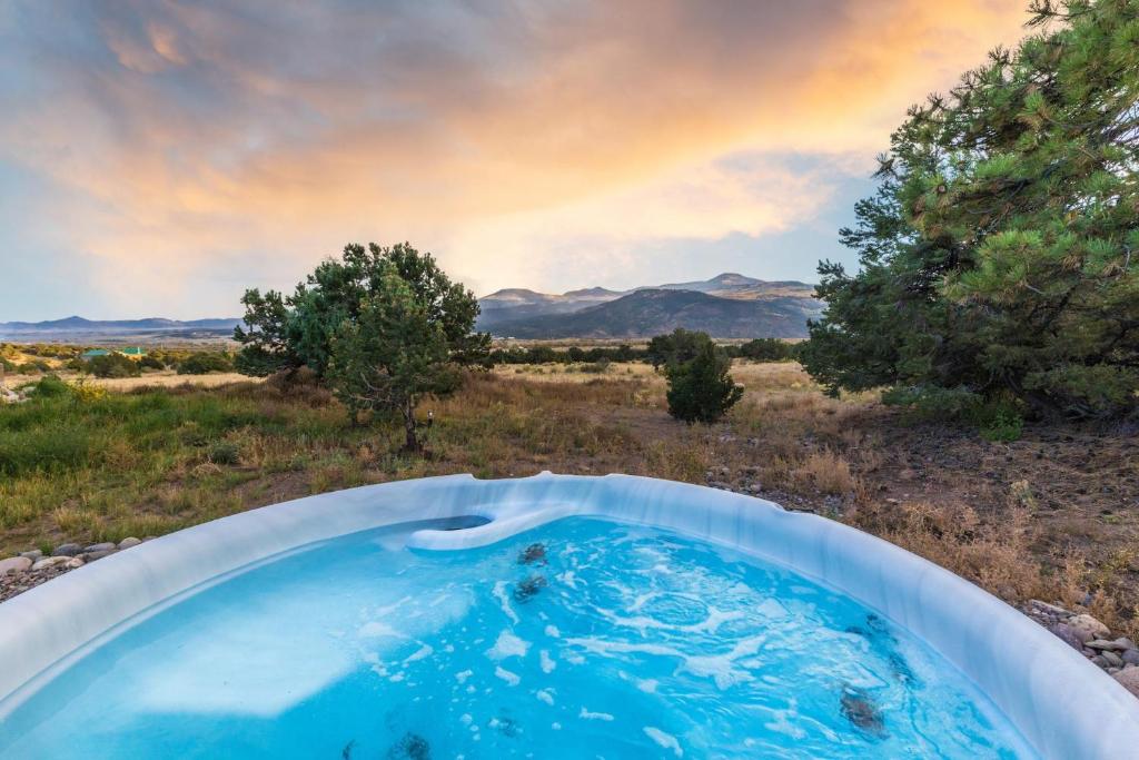 a bath tub in the middle of a field at Rocking M Ranch in South Fork, CO in South Fork