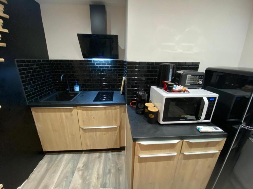 Kuchyň nebo kuchyňský kout v ubytování Maison Cosyli