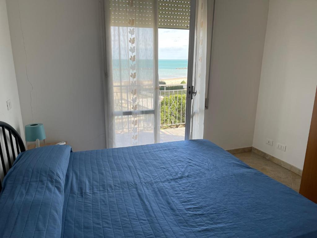 Postel nebo postele na pokoji v ubytování Residence Adriano
