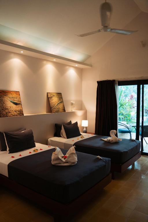 Postel nebo postele na pokoji v ubytování Battambang Resort