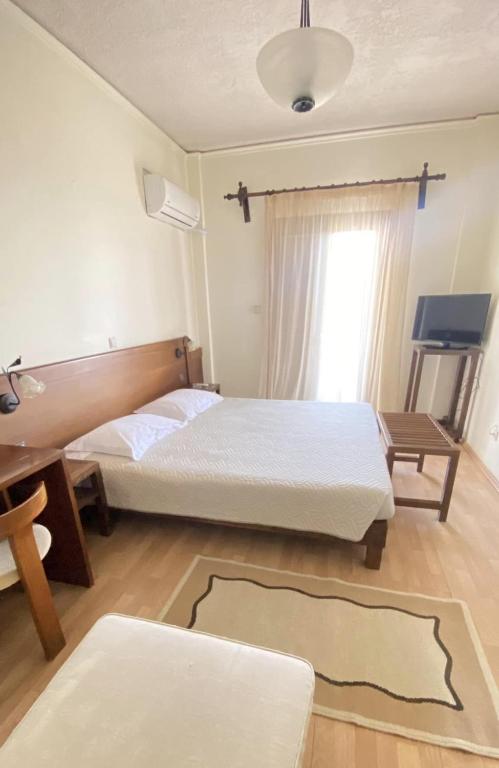 Postel nebo postele na pokoji v ubytování Philoxenia