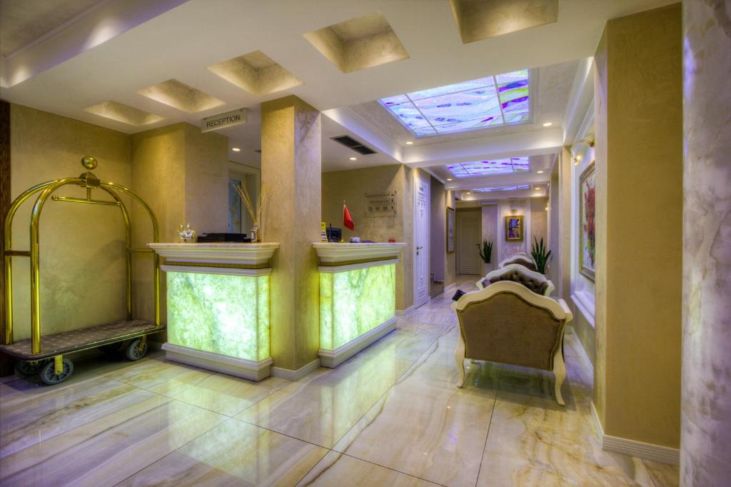 a hallway of a building with a skylight at Lot Boutique Hotel by Hotels and Preference in Tirana
