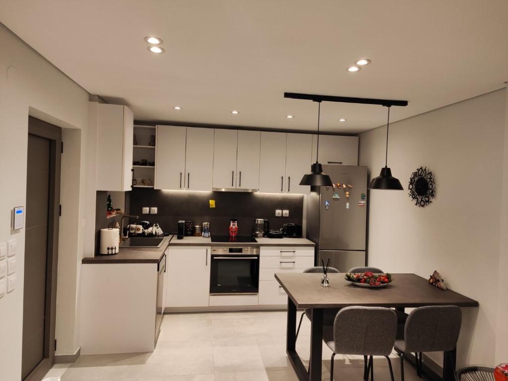 Kuchyň nebo kuchyňský kout v ubytování Pavliani Apartments