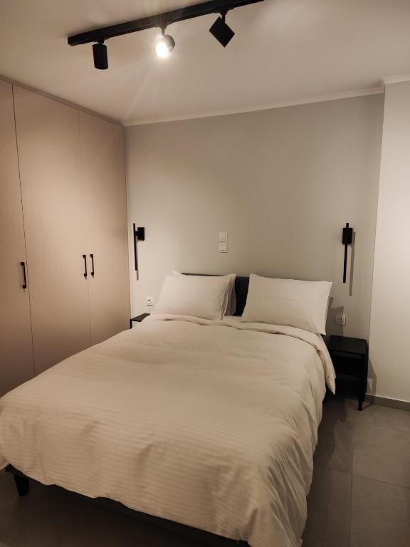 Postel nebo postele na pokoji v ubytování Pavliani Apartments