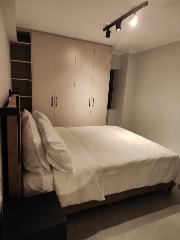 Postel nebo postele na pokoji v ubytování Pavliani Apartments