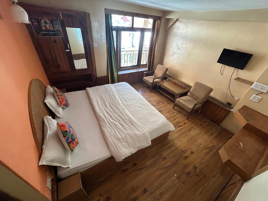 TV a/nebo společenská místnost v ubytování Hotel BHRIGU