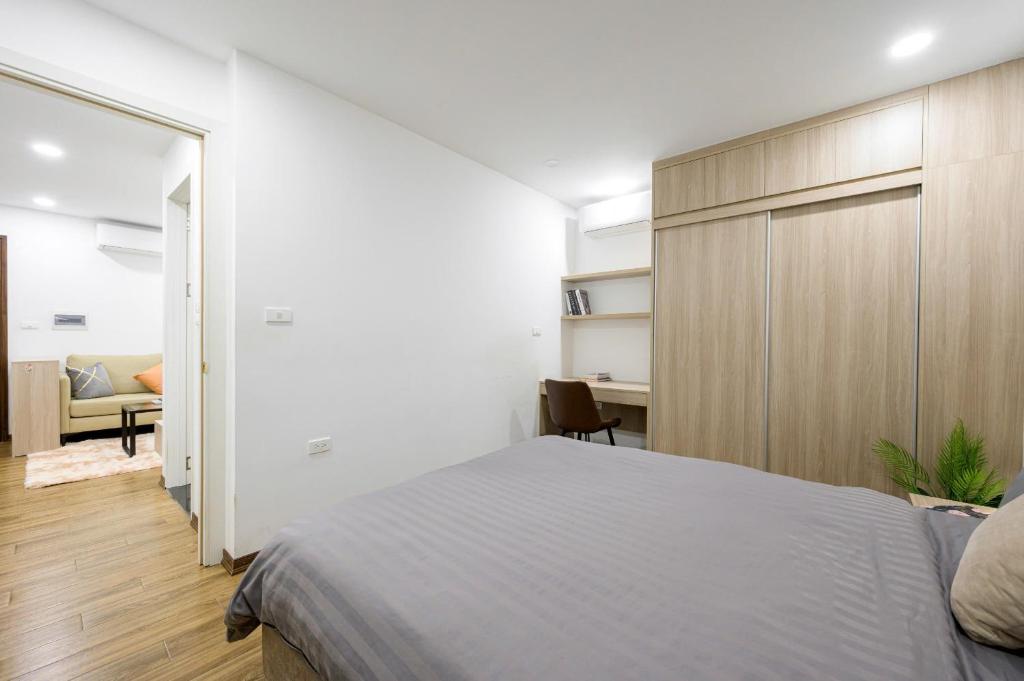 Postel nebo postele na pokoji v ubytování Luxe Paradise Hotel Nguyen Khac Hieu