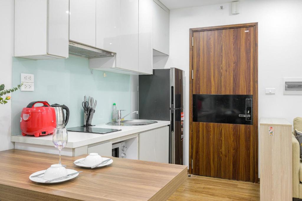 Kuchyň nebo kuchyňský kout v ubytování Luxe Paradise Hotel Nguyen Khac Hieu